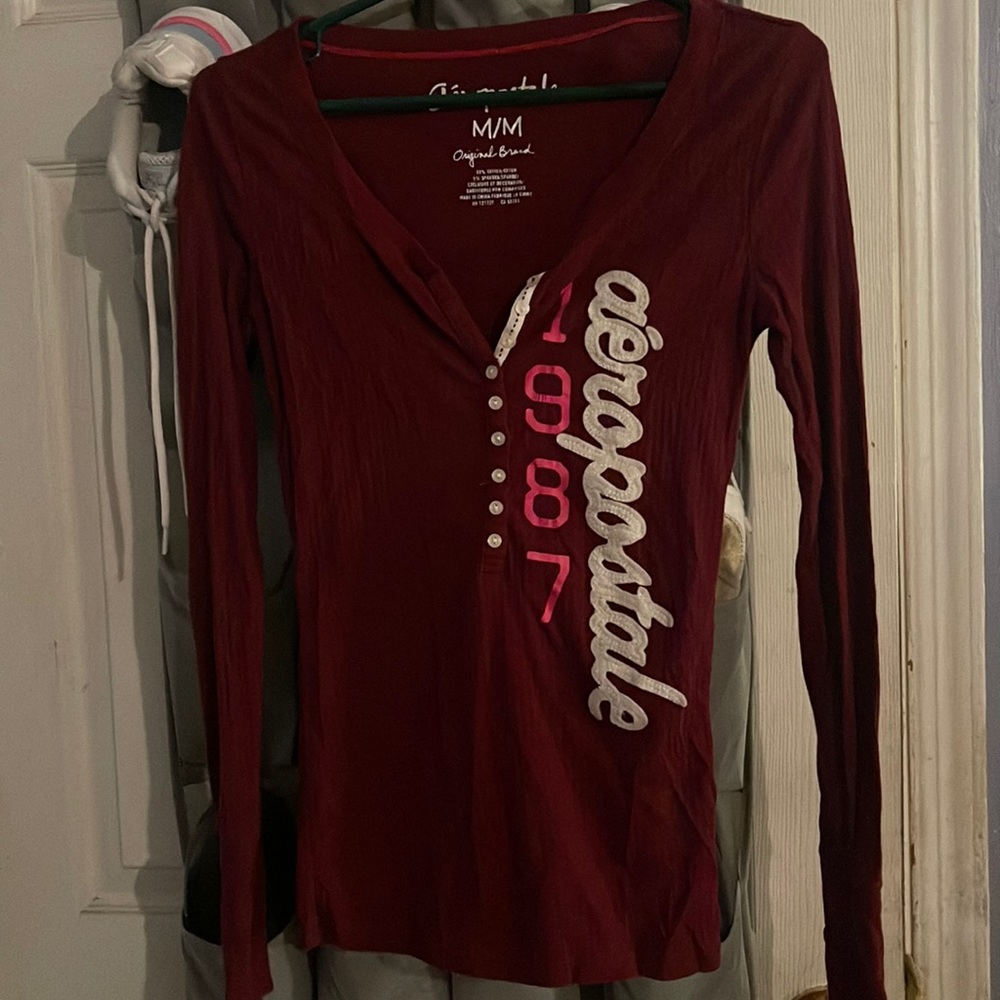 Medium burgundy in color AéRopostale T-shirt says 1987 Aeropostale